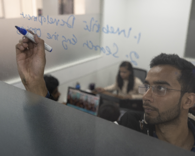 Zubair Ahmed brainstorms at his company's office in New Delhi, India (AtlasNetwork.org Photo/Bernat Parera).